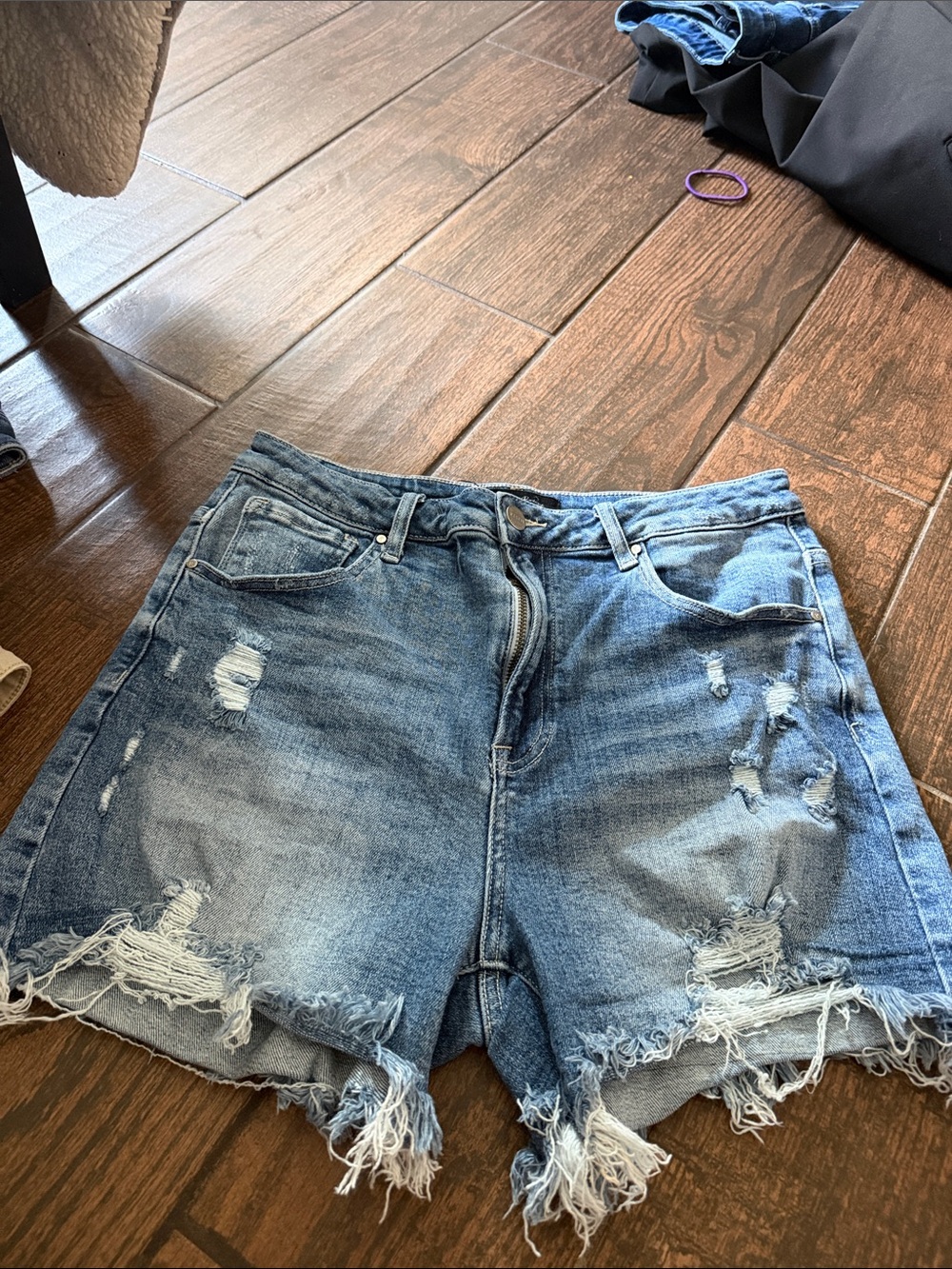 High-Rise Distressed Denim Shorts in Blue